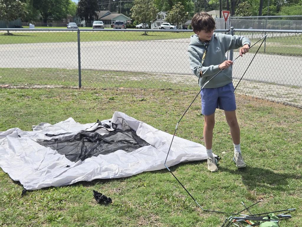 Mr. Rivers teaches how to assemble a tent in ProTeam.