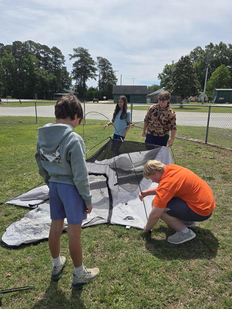 Mr. Rivers teaches how to assemble a tent in ProTeam.