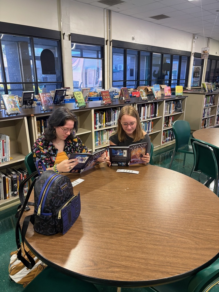 Students reading in the library. 