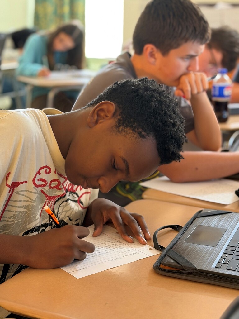 Student participating in a 9/11 remembrance activity during their Advanced Composition class.