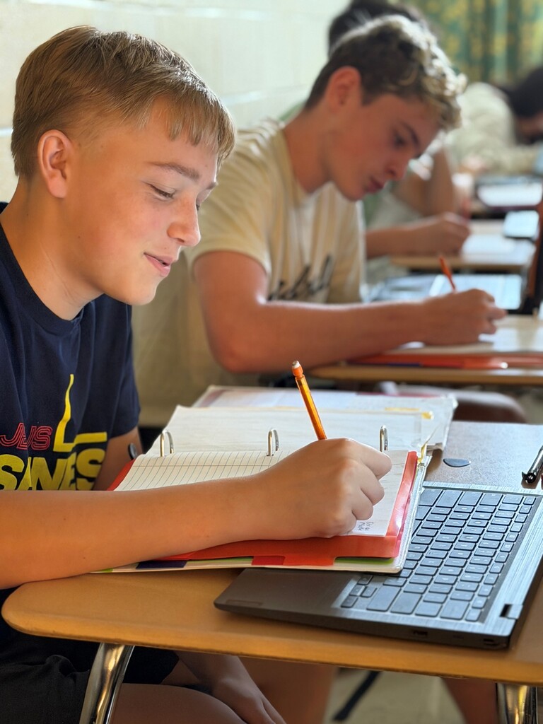 Student participating in a 9/11 remembrance activity during their Advanced Composition class.