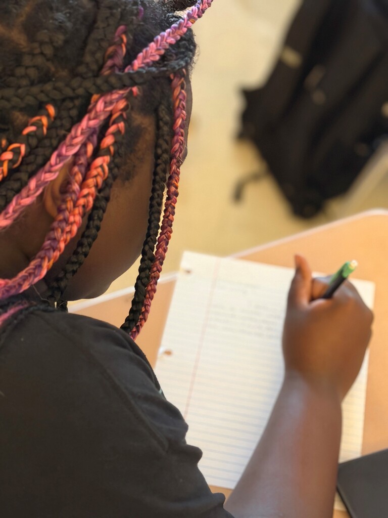 Student participating in a 9/11 remembrance activity during their Advanced Composition class.