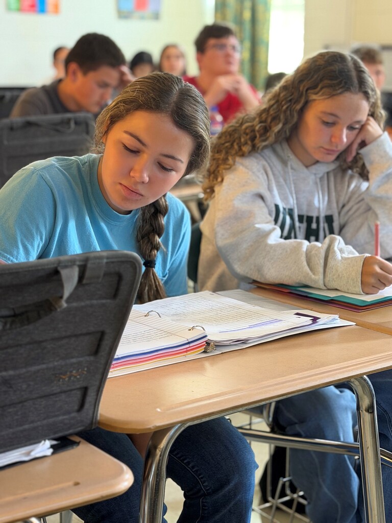 Student participating in a 9/11 remembrance activity during their Advanced Composition class.
