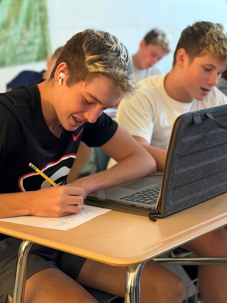 Student participating in a 9/11 remembrance activity during their Advanced Composition class.