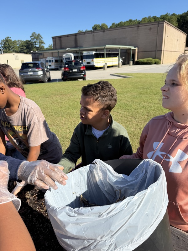 Students planting the raised garden beds at LMS