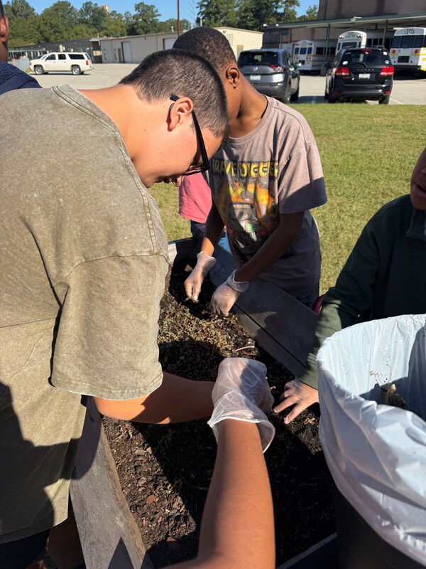 Students planting the raised garden beds at LMS