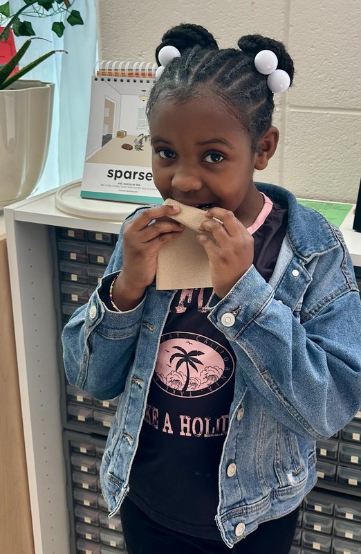 Student at LES trying new fruit