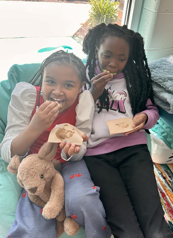 Student at LES trying new fruit