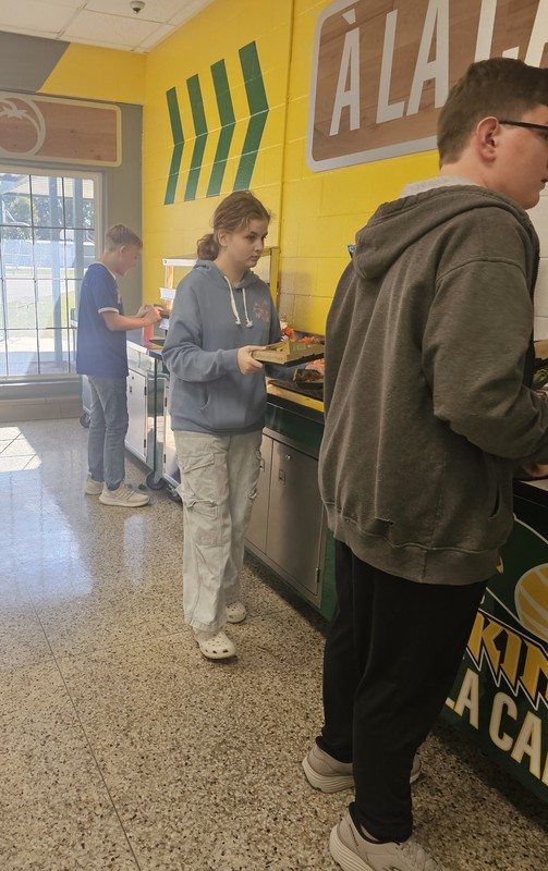 Students in line for new pizza