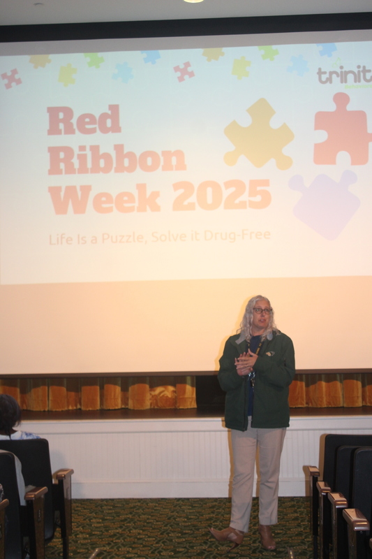 Principal introduces presenter at the RRW assembly.