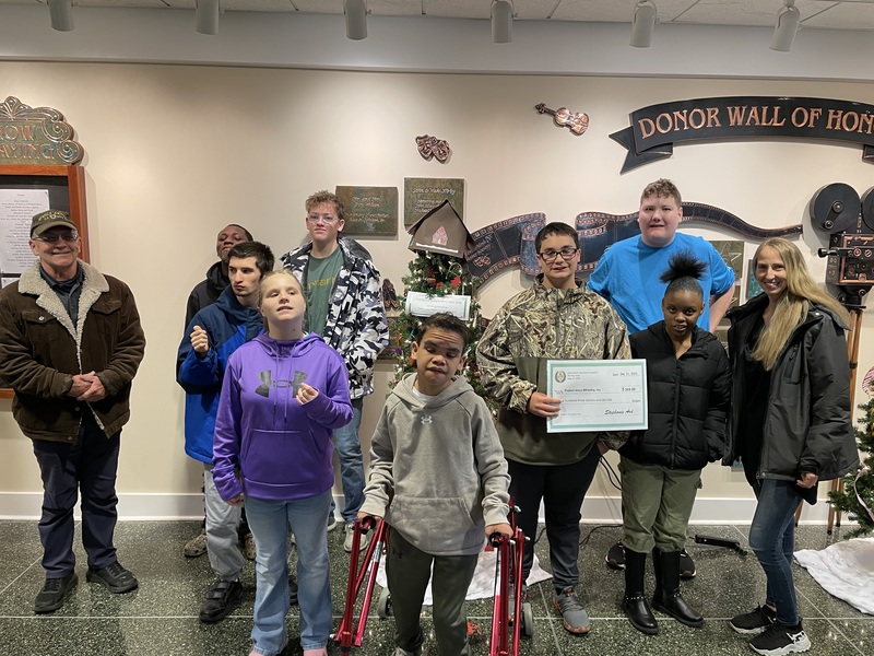 LHS/LMS Student presenting donation to Project Jesus Ministry