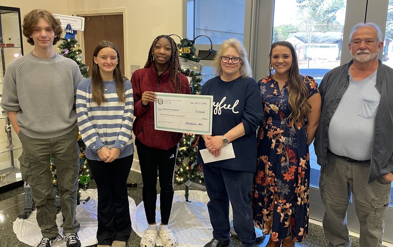 LHS Academic Challenge Team presenting check to The Winkeler Foundation