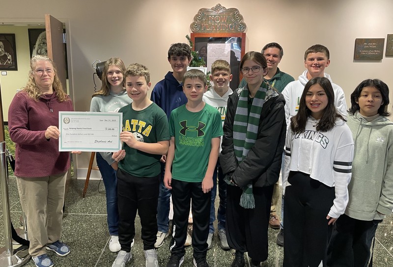 LMS Academic Challenge Team presenting donation to Helping Hand Food Bank