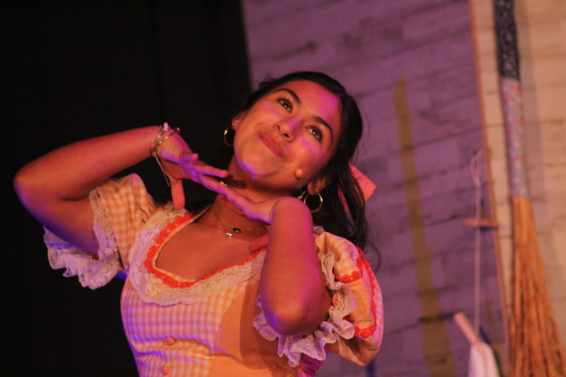 Students perform on stage