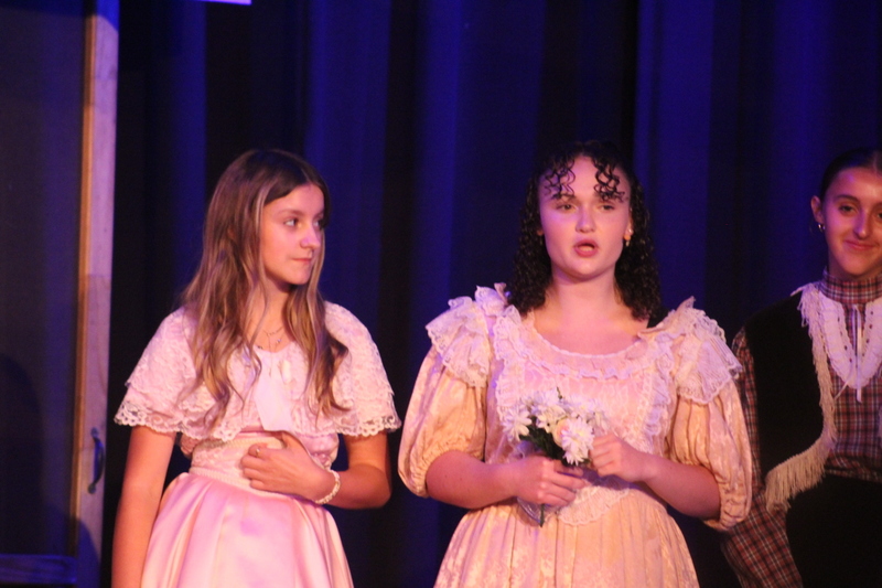 Students perform on stage