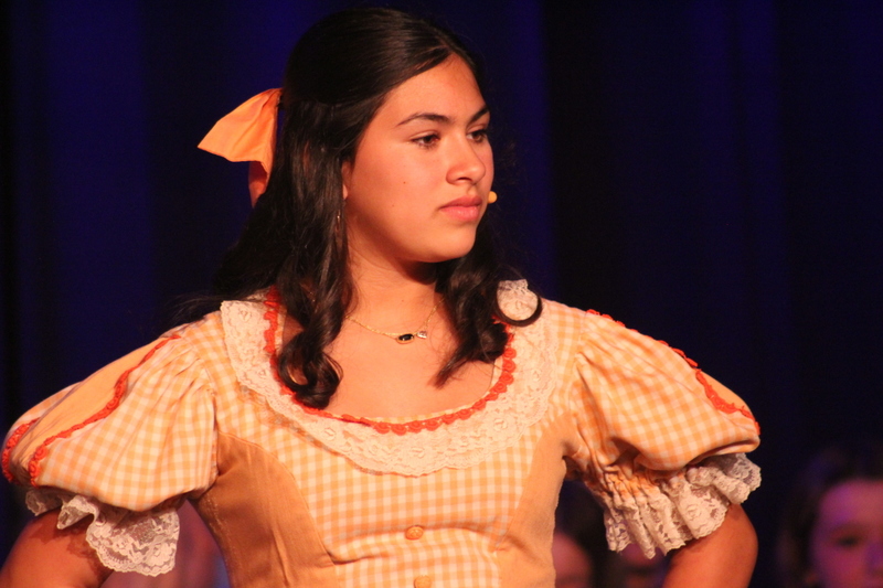 Students perform on stage
