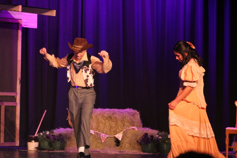Students perform on stage