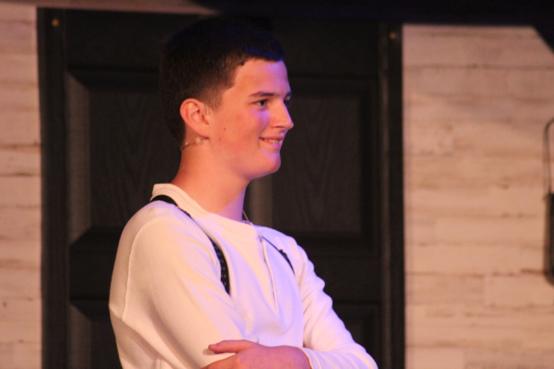 Students perform on stage