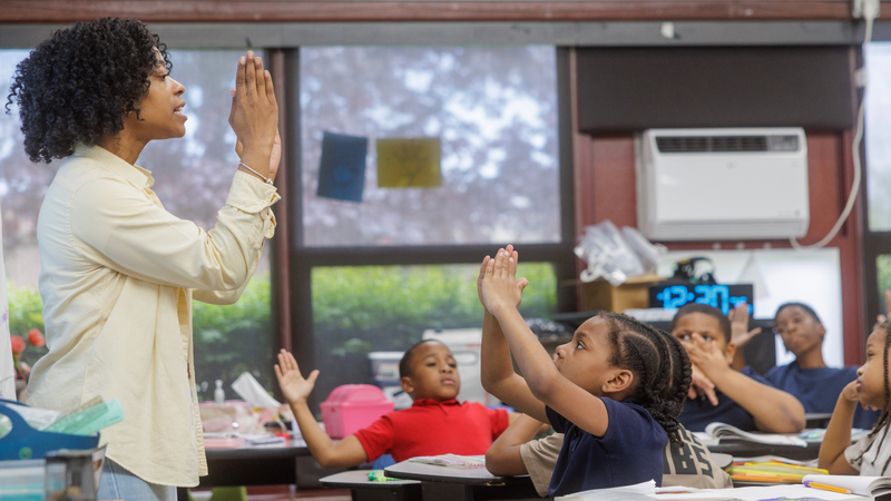Teacher with students