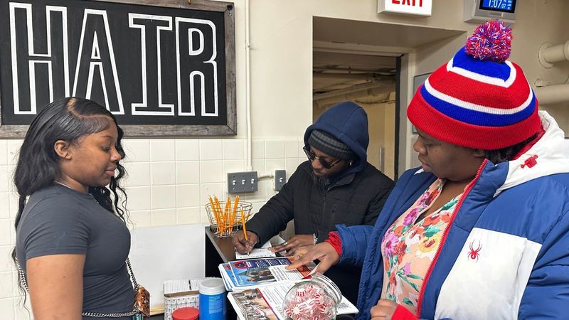 Salon student welcoming guests