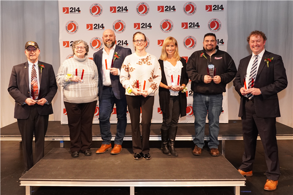 (From left) Greg Padovani, Jan Plachy, Nick Ruffolo, Colleen Wytmar, Wendy Johnson (accepting the award on behalf of Kathy Aykroid), Rolando "R.J." Gomez and Jack Costello were honored with this year's District 214 Distinguished Service Award.