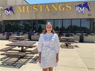 Behak in front of RM Mustangs