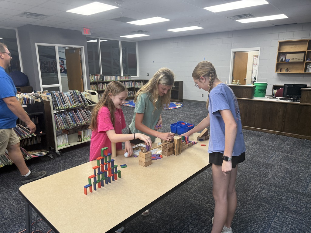 girls creating with blocks
