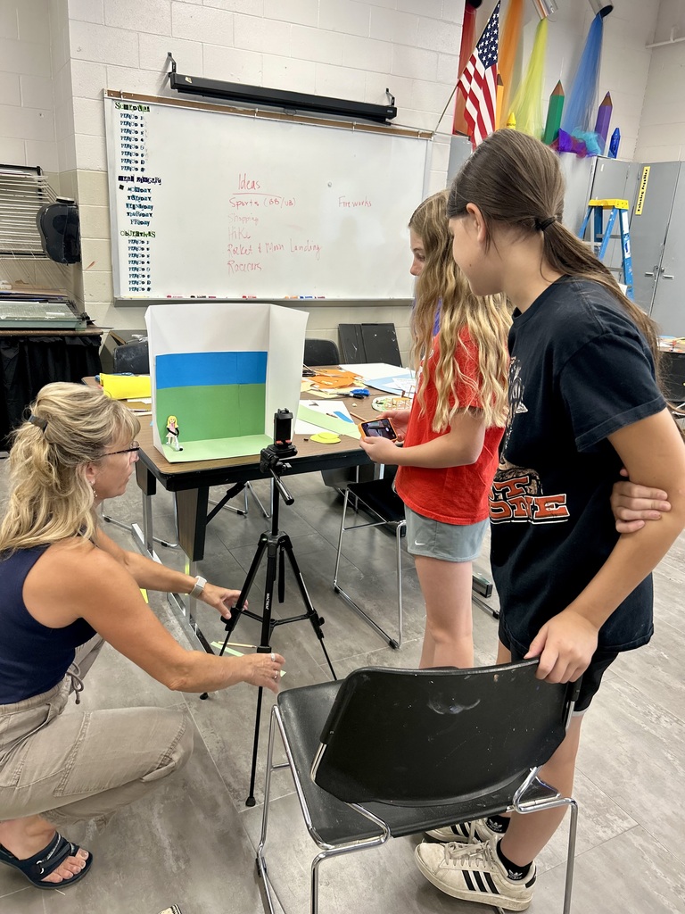 2 female students and Mrs. Gill creating a stop motion video
