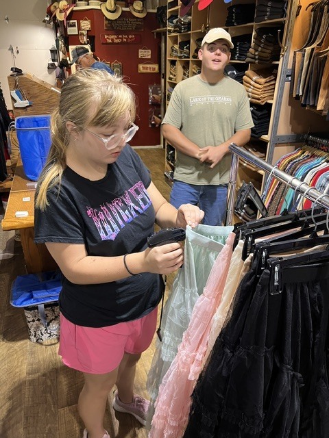student tagging clothing