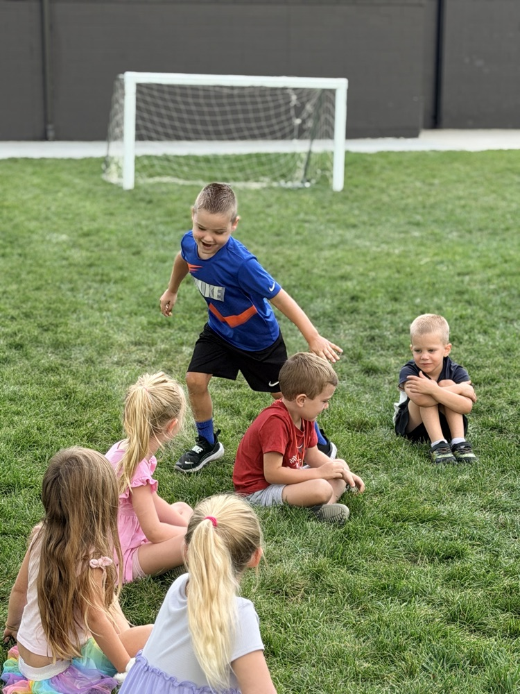 Kindergarteners Playing Duck, Duck, Goose!