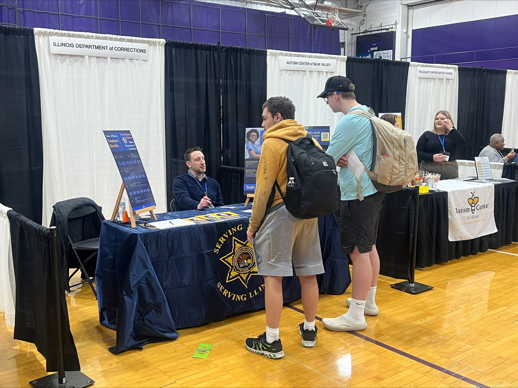 students at career fair listening to speakers at each booth