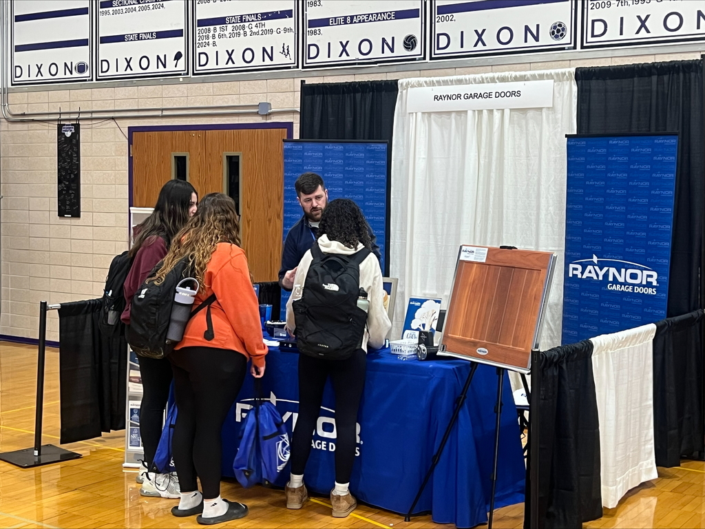 students at career fair listening to speakers at each booth