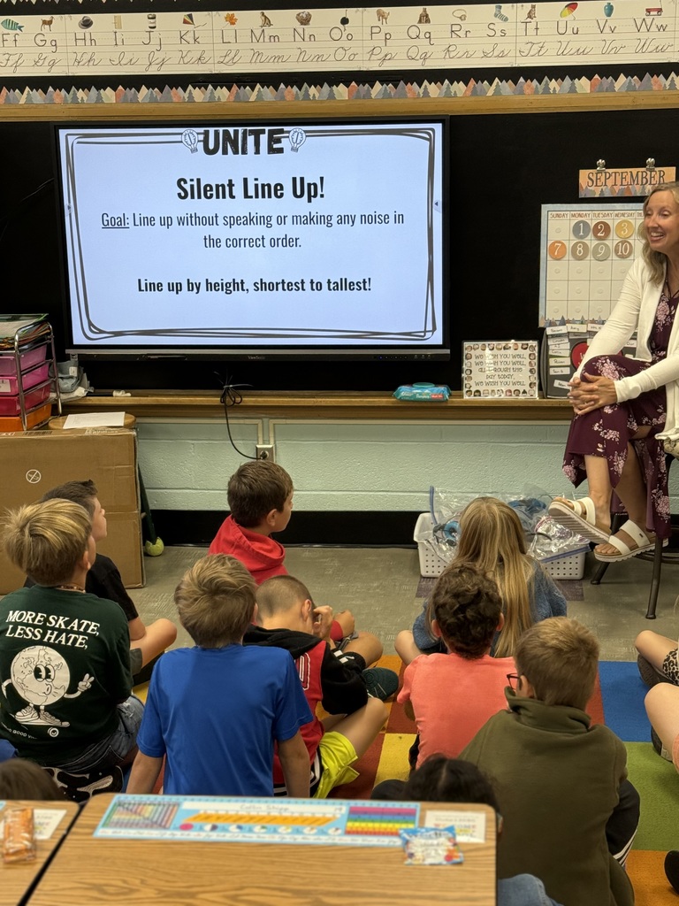 Mrs. Kuehl with her third graders introducing a uniting activity
