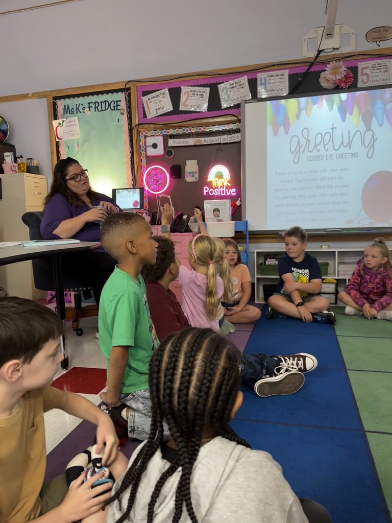 Mrs. Kingham leading her 2nd graders through a good morning activity