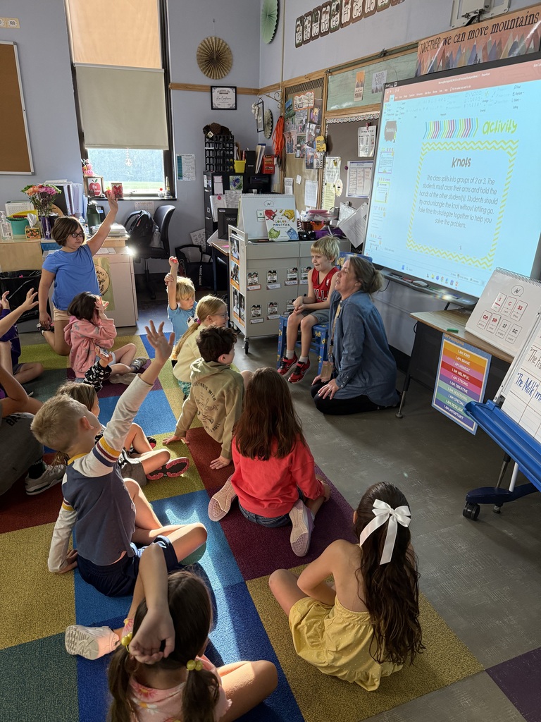 Mrs. Conderman with her class completing a uniting activity