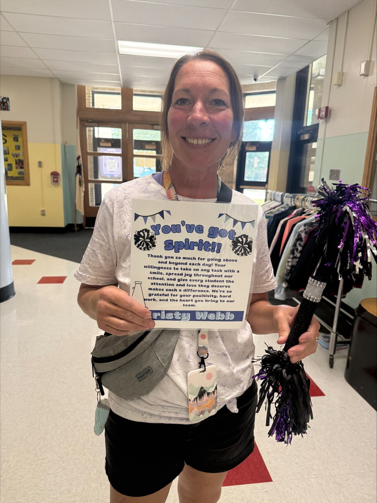 Mrs. Webb with the spirit stick and her certificate of appreciation.