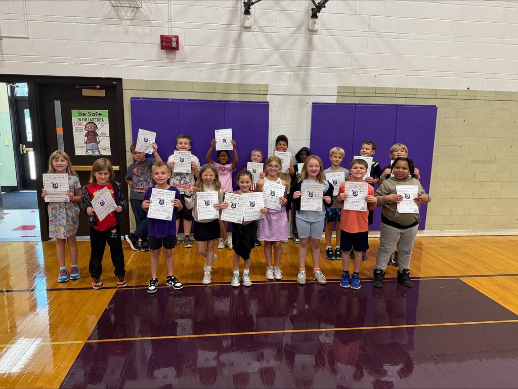 Third grade students with positive office referral certificates and prizes.