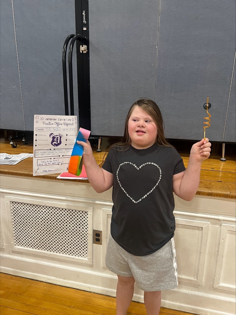 4th grader with her positive office referral and prize 