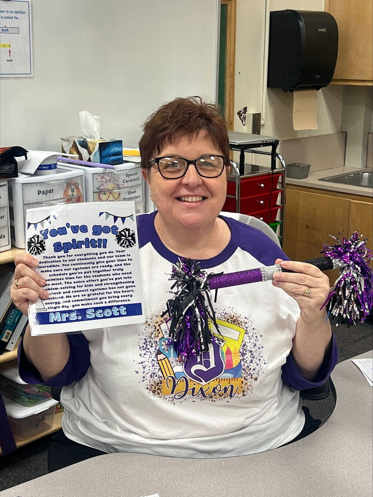 Mrs. Scott with her spirit stick and her certificate. 