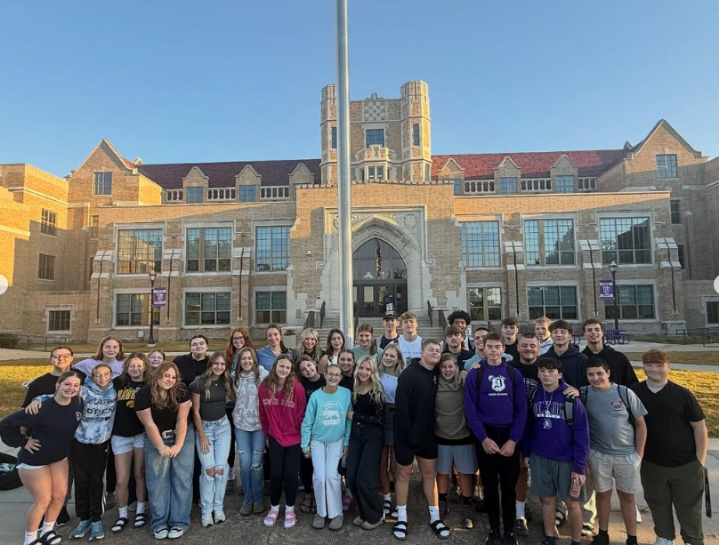 students representing their faith around flag pole