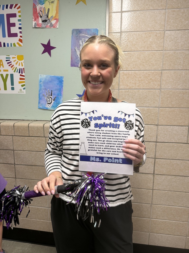 Ms Point with her certificate and spirit stick