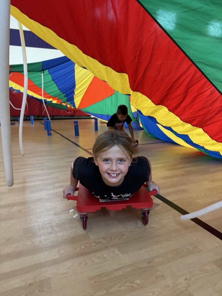 a third grader on her scooter  in the scooter fort 