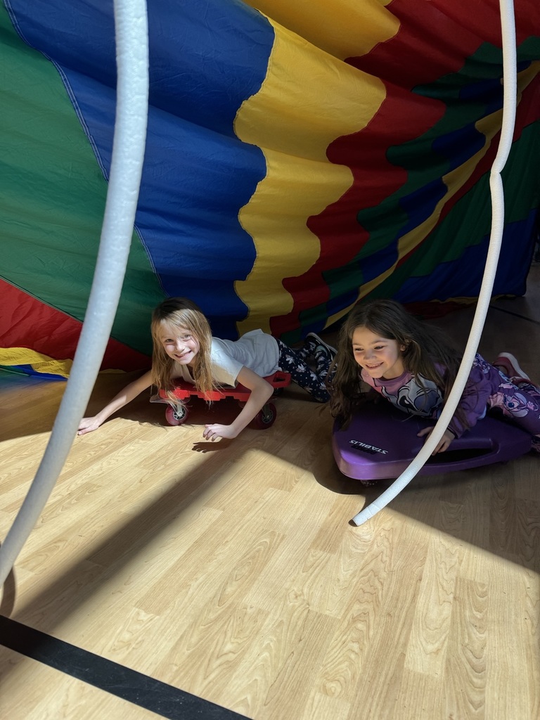 2nd graders scooters in the parachute fort 