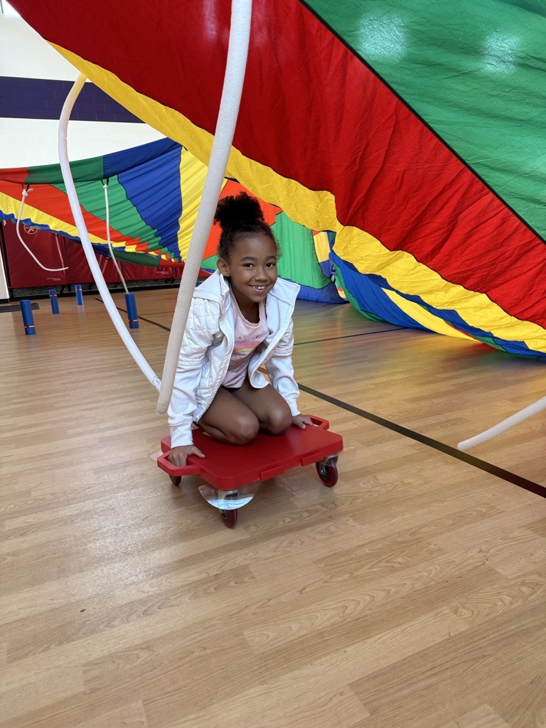 a third grader on her scooter  in the scooter fort 