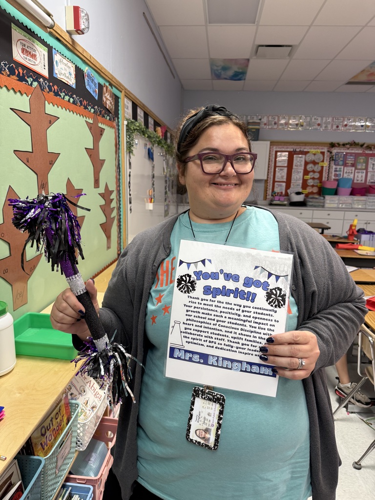 Mrs. Kingham and her spirit stick and certificate 