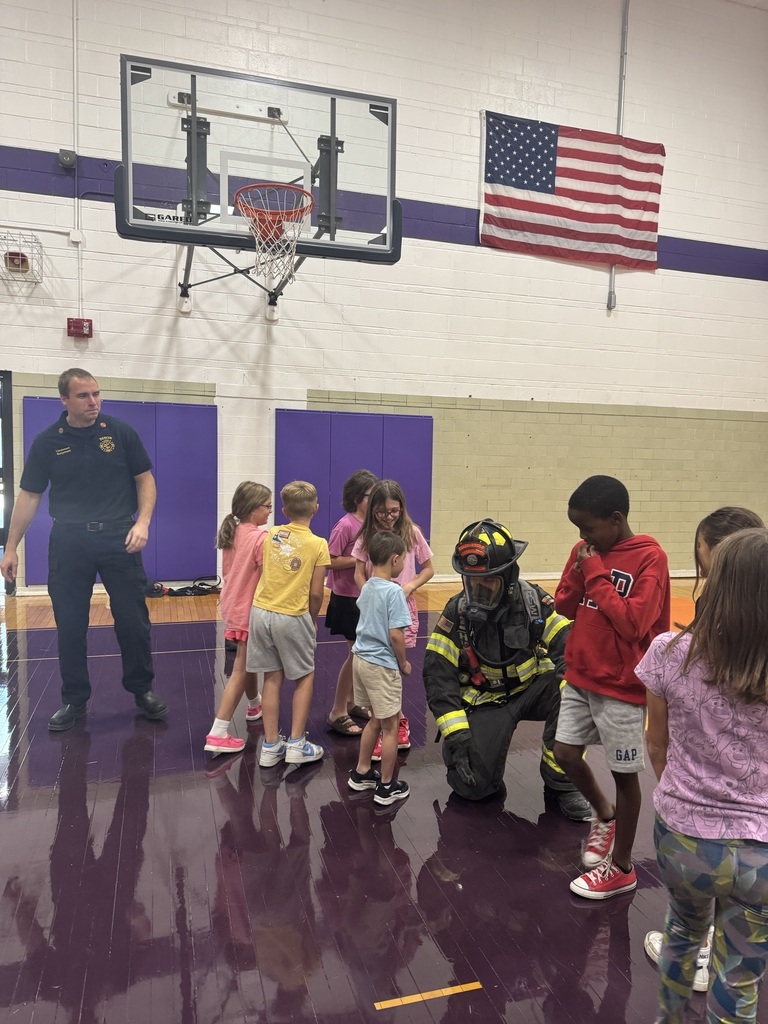 Fire fighters allow students to check out the gear