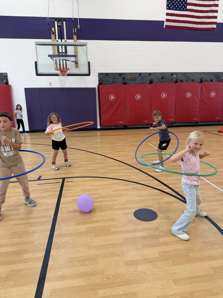students hulahooping in fitness friday