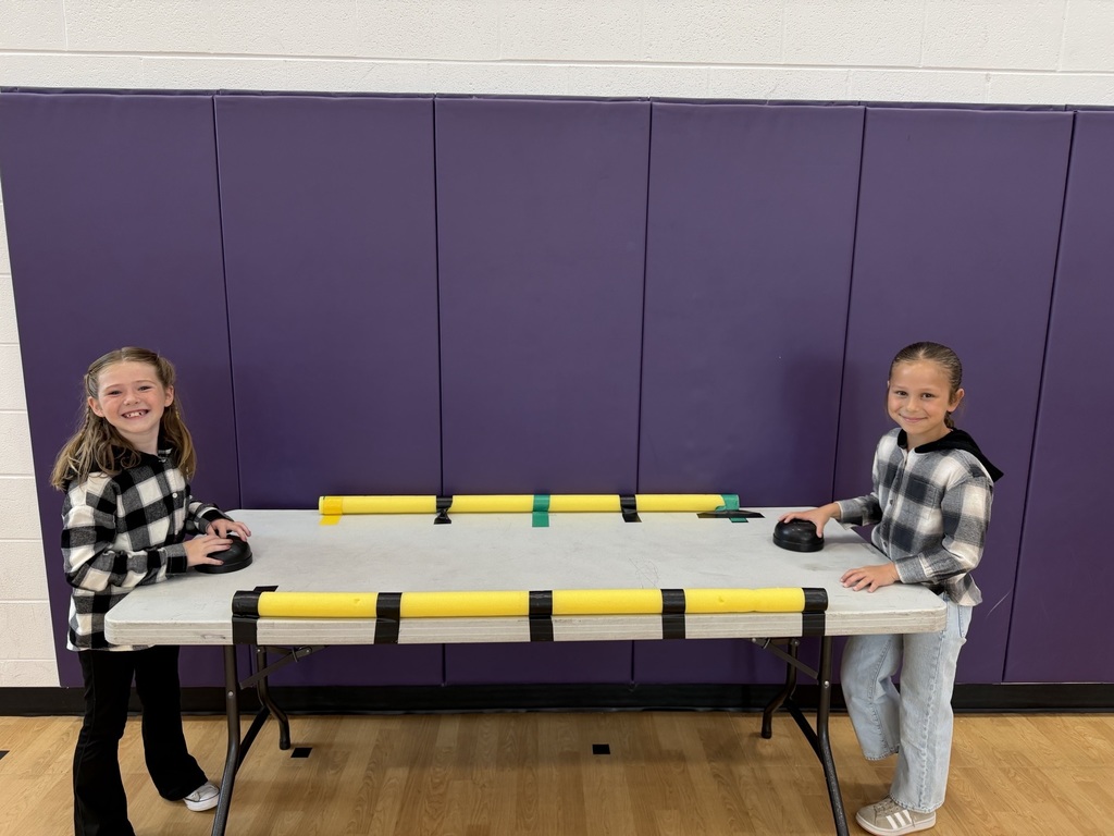 students playing air hocky in fitness friday