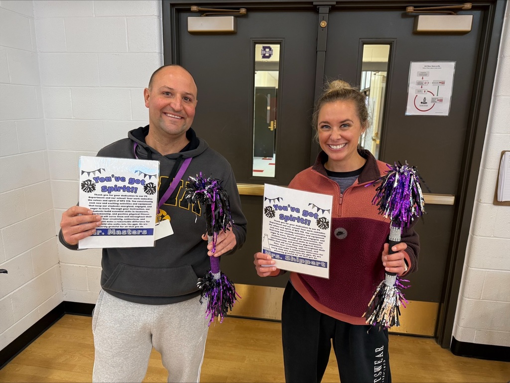 Mr. Masters and Mrs. Shippert with their spirit sticks and certificates.
