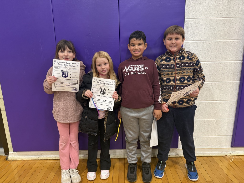 2nd grade students study luminescence using glow sticks and plastic cups